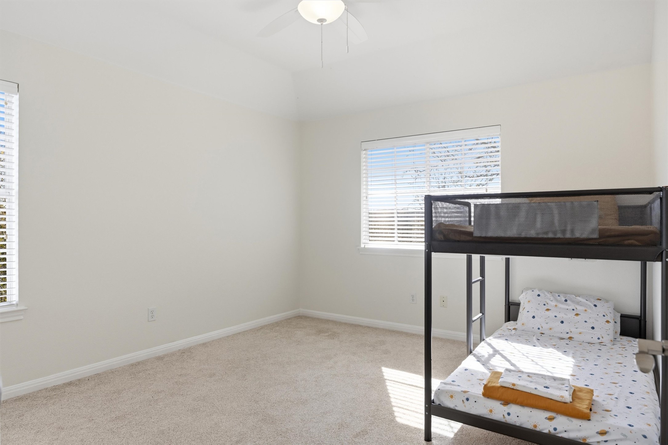 9400 Savannah Ridge Drive Austin, TX 78726 - Photo 25 of 35 a bedroom with a bed and a window