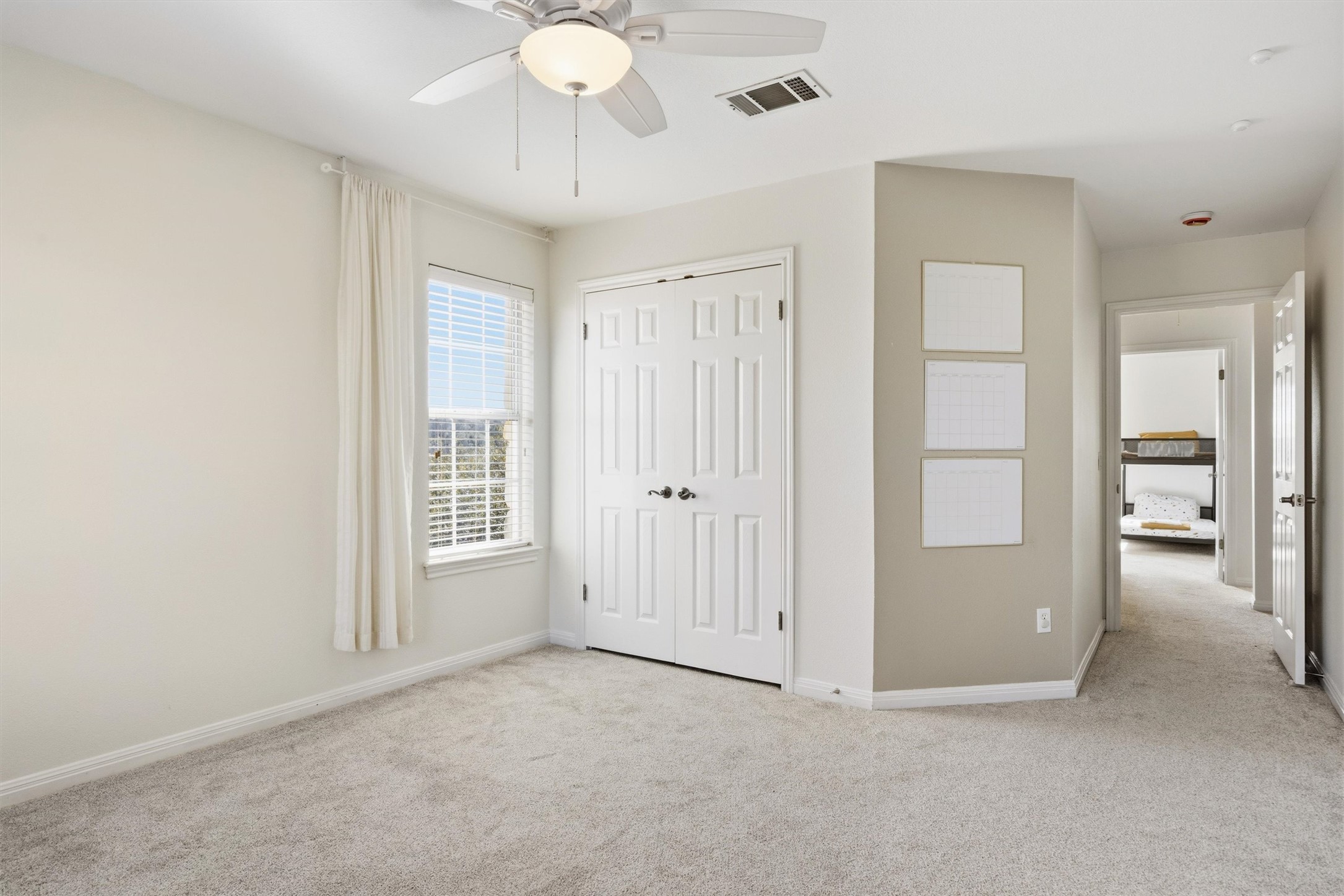 9400 Savannah Ridge Drive Austin, TX 78726 - Photo 28 of 35 an empty room with windows and entrance