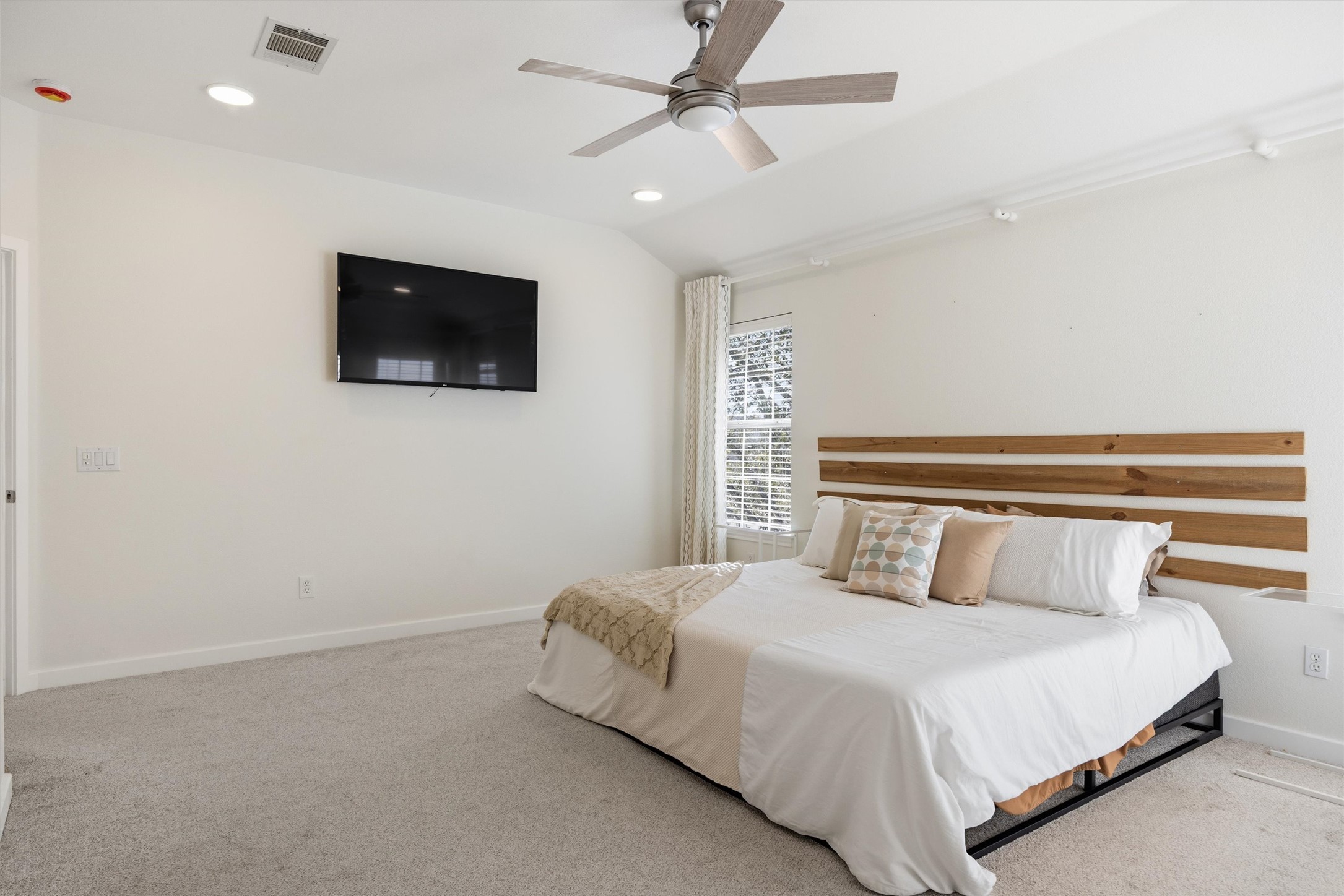 9400 Savannah Ridge Drive Austin, TX 78726 - Photo 31 of 35 a bedroom with a bed and a flat screen tv