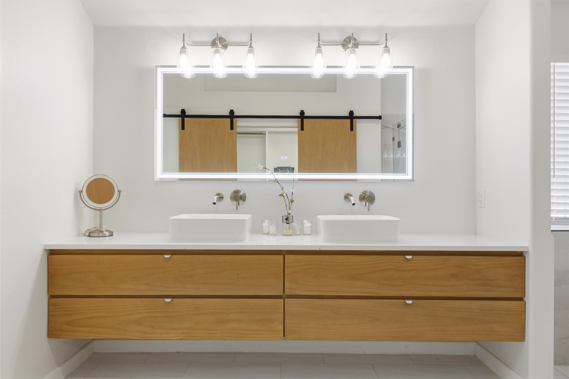 9400 Savannah Ridge Drive Austin, TX 78726 - Photo 32 of 35 a bathroom with a sink and a mirror