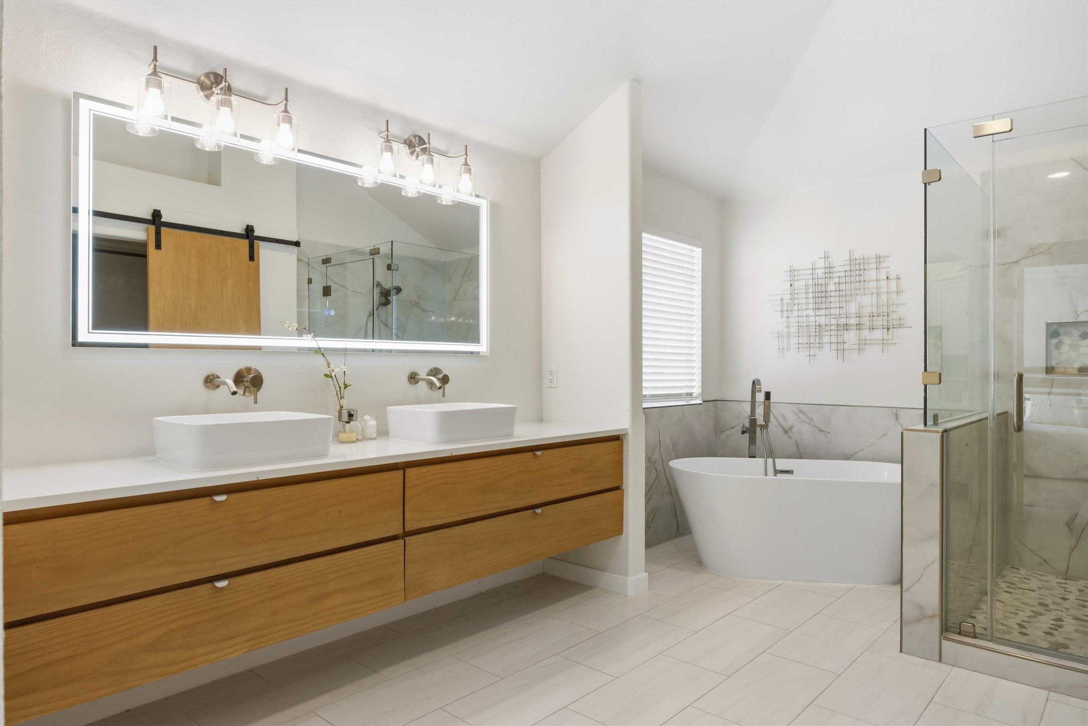 9400 Savannah Ridge Drive Austin, TX 78726 - Photo 33 of 35 a bathroom with a tub sink double vanity and mirror