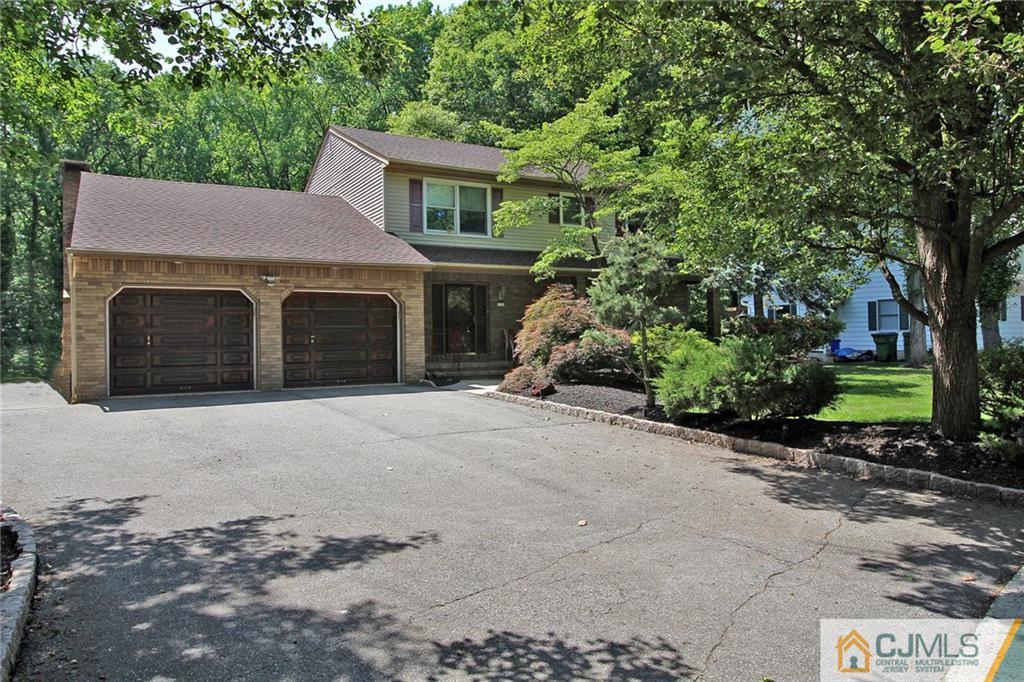 53 Hillsdale Road Edison, NJ 08820 - Photo 1 of 25 a front view of a house with a garden and yard