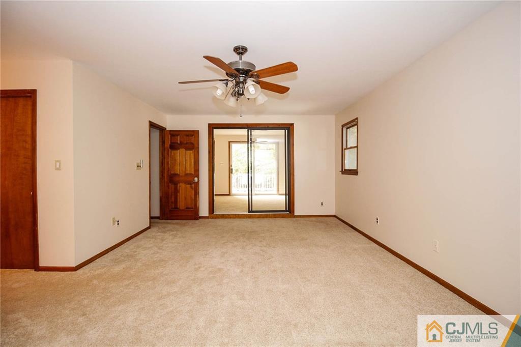 53 Hillsdale Road Edison, NJ 08820 - Photo 14 of 25 an empty room with windows and fan