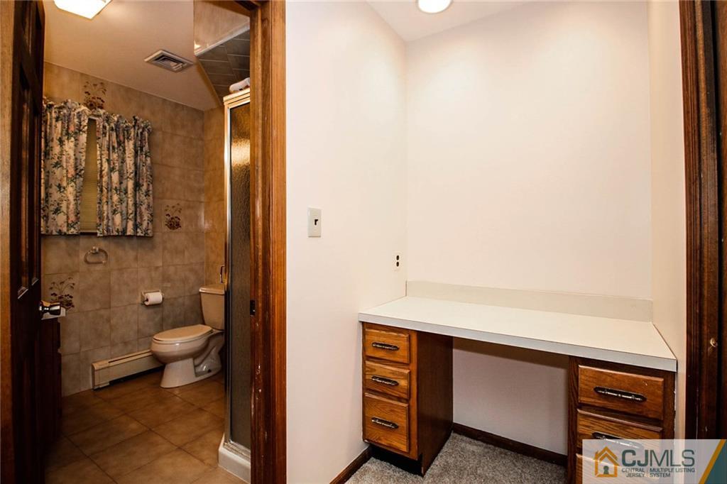 53 Hillsdale Road Edison, NJ 08820 - Photo 17 of 25 a bathroom with a sink a toilet and shower