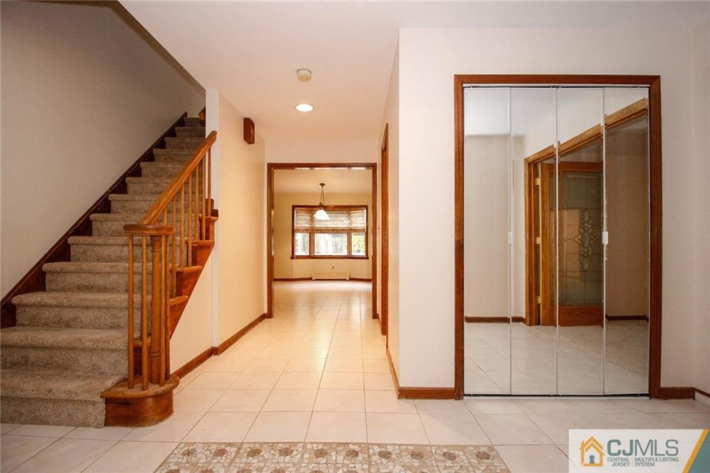 53 Hillsdale Road Edison, NJ 08820 - Photo 3 of 25 a view of entryway with wooden floor and stairs