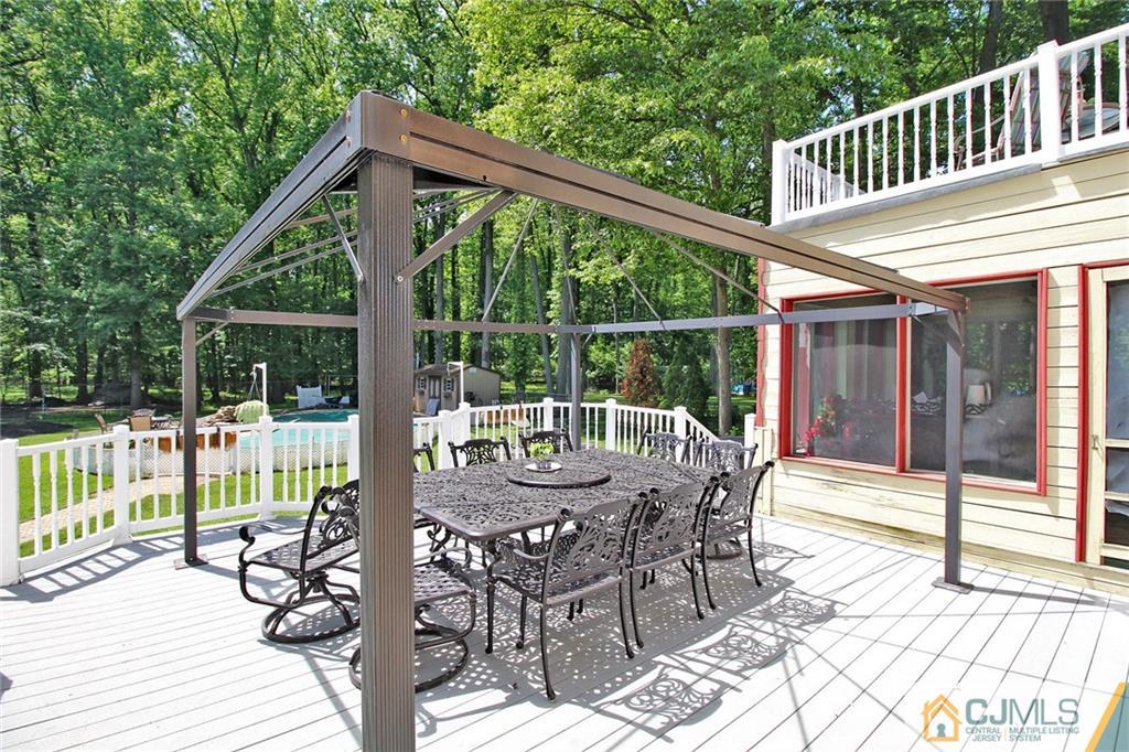 53 Hillsdale Road Edison, NJ 08820 - Photo 22 of 25 a view of a chair and table on the deck