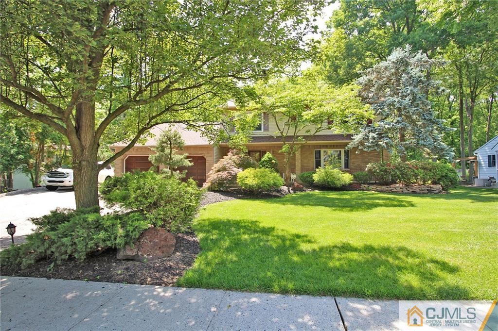 53 Hillsdale Road Edison, NJ 08820 - Photo 23 of 25 a front view of a house with garden