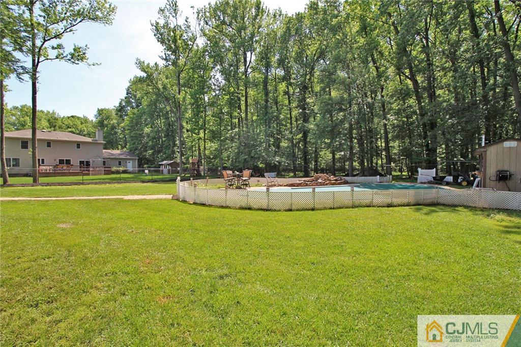 53 Hillsdale Road Edison, NJ 08820 - Photo 24 of 25 a view of a swimming pool with an outdoor space and seating area