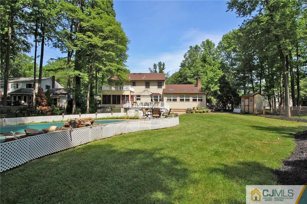 53 Hillsdale Road Edison, NJ 08820 - Photo 25 of 25 a front view of a house with garden and sitting area