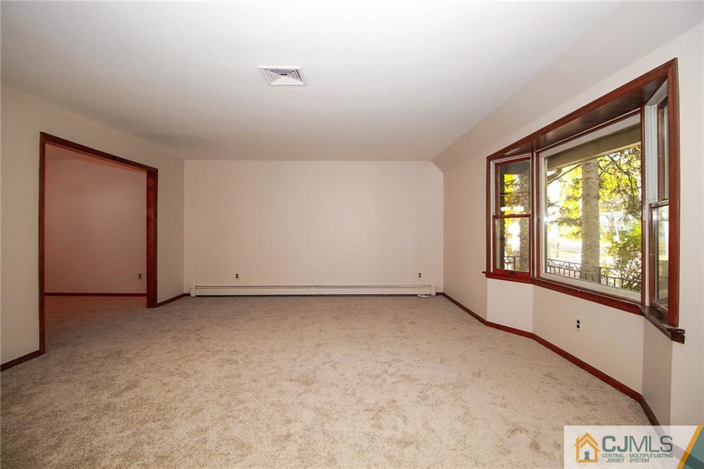 53 Hillsdale Road Edison, NJ 08820 - Photo 4 of 25 an empty room with windows