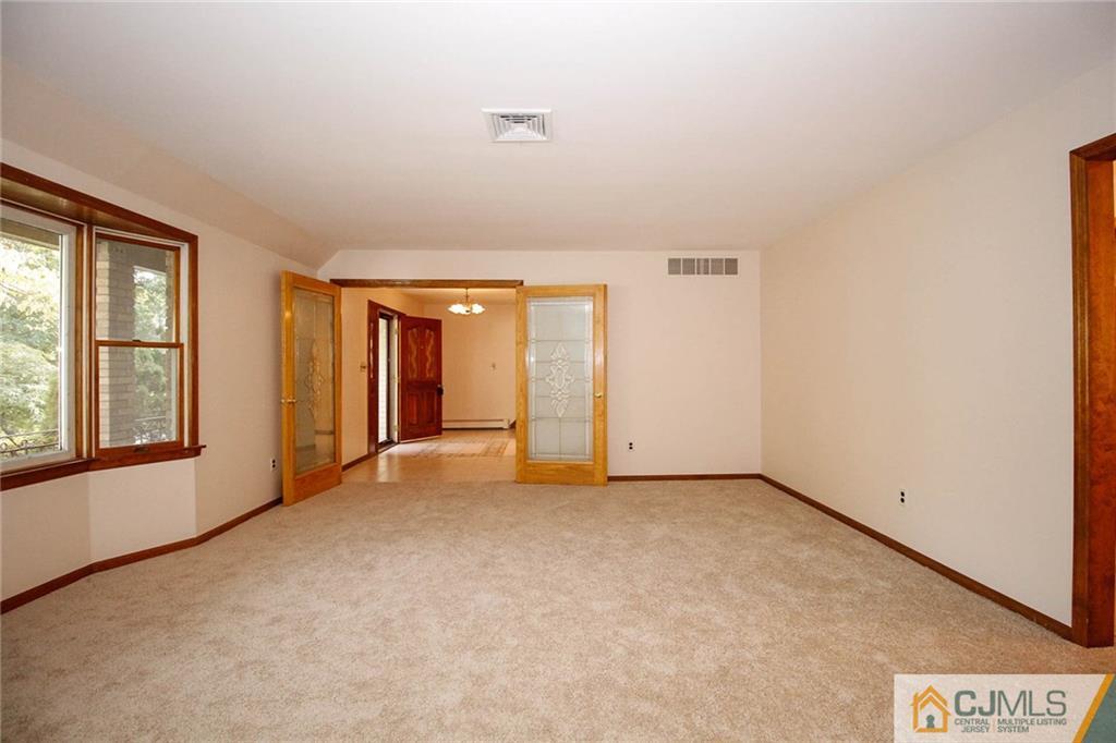 53 Hillsdale Road Edison, NJ 08820 - Photo 5 of 25 an empty room with windows
