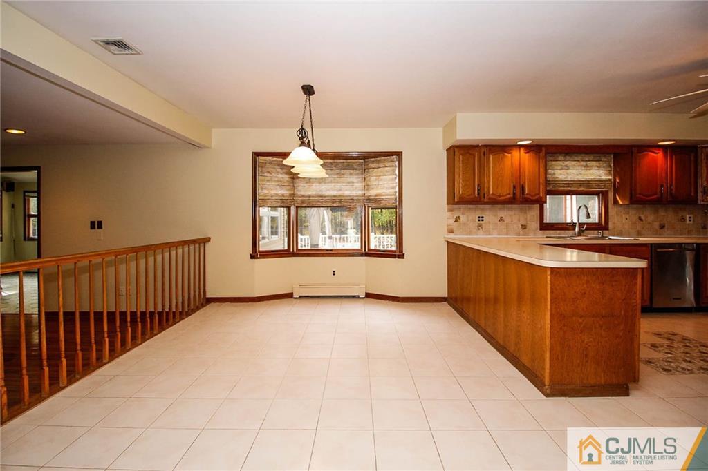 53 Hillsdale Road Edison, NJ 08820 - Photo 10 of 25 a view of a kitchen with a sink dishwasher and a microwave