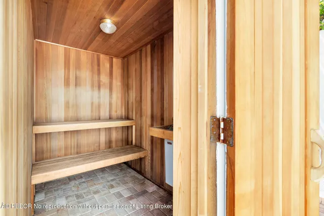 a living room with furniture and a book shelf