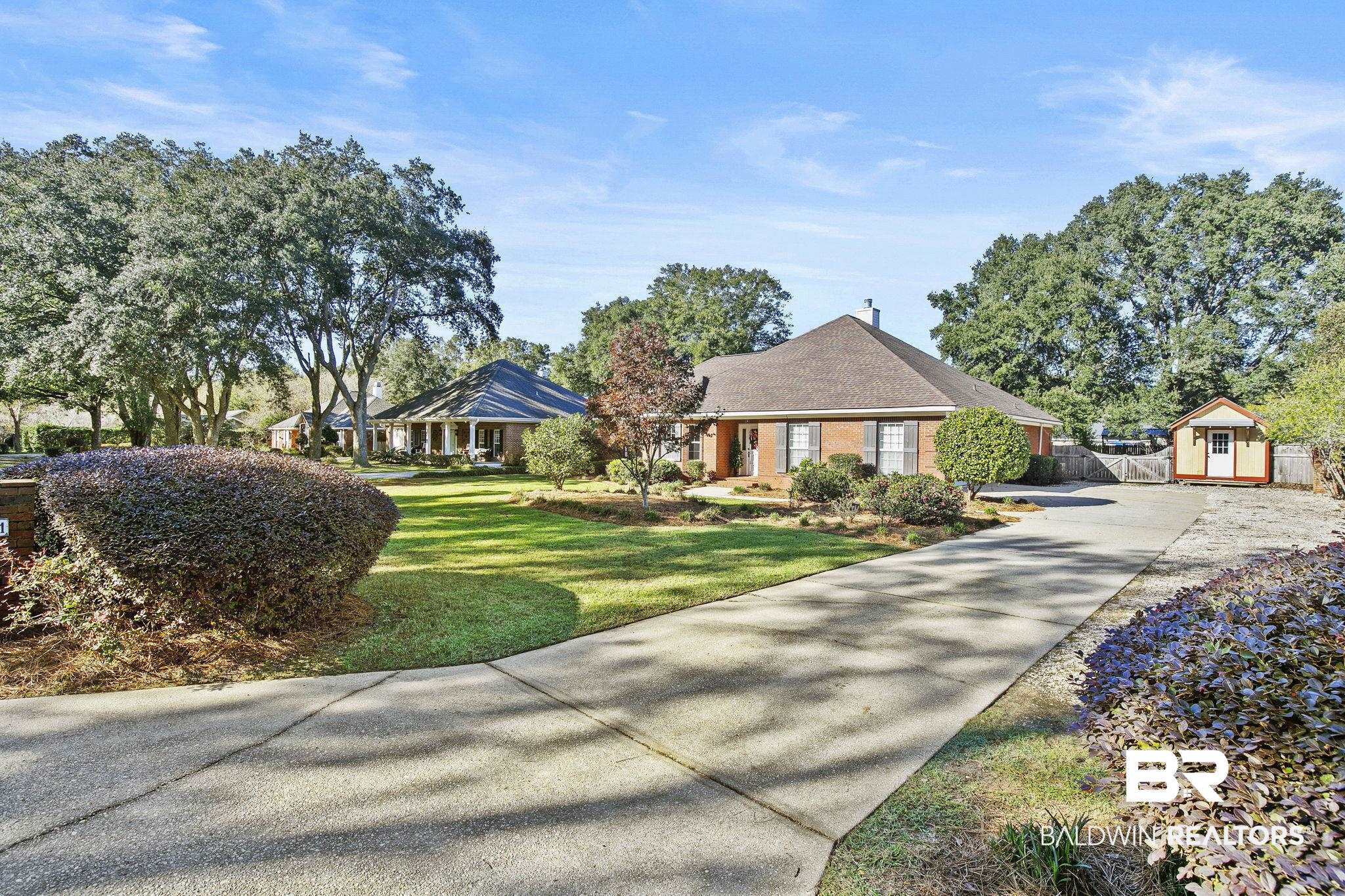 9631 Bay Meadows Avenue Fairhope, AL 36532 - Photo 4 of 49 Single story home featuring a storage unit and a front lawn