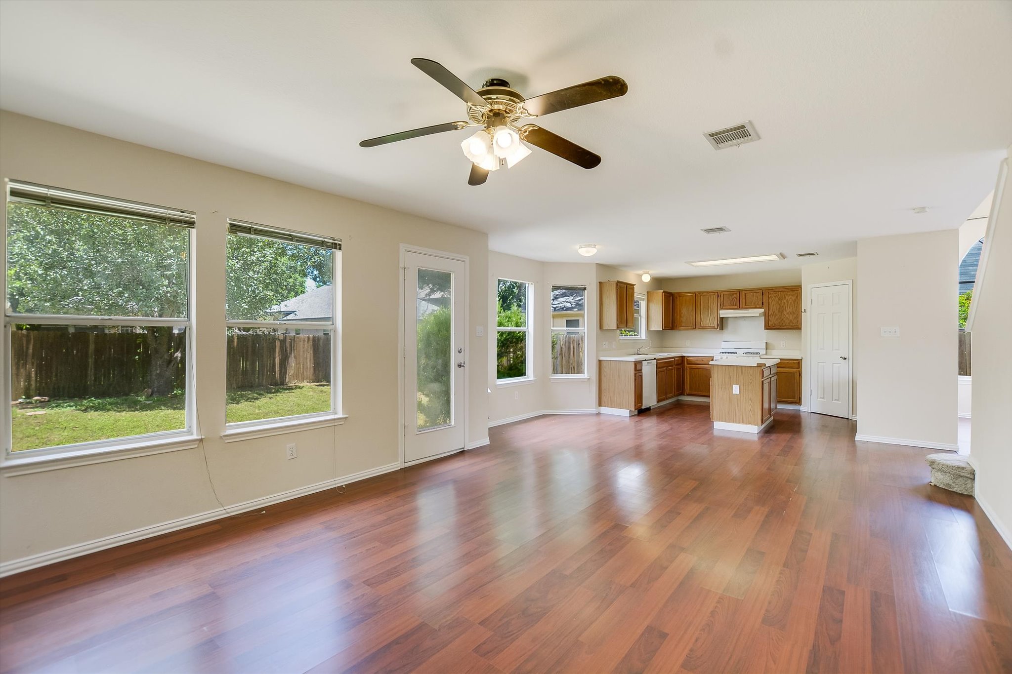 1008 Double File Trail Round Rock, TX 78665 - Photo 20 of 20 An inviting open floorplan offers a seamless flow between living areas, with rich hardwood flooring and abundant natural light.