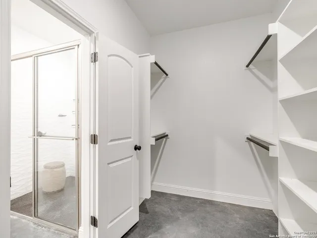 a view of a kitchen with a sink and a window