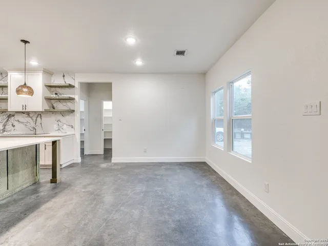 a kitchen with a sink and refrigerator