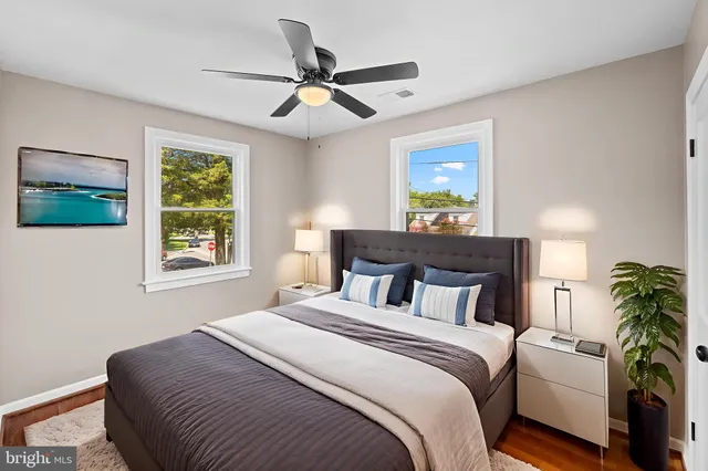 a bedroom with a large bed and a window