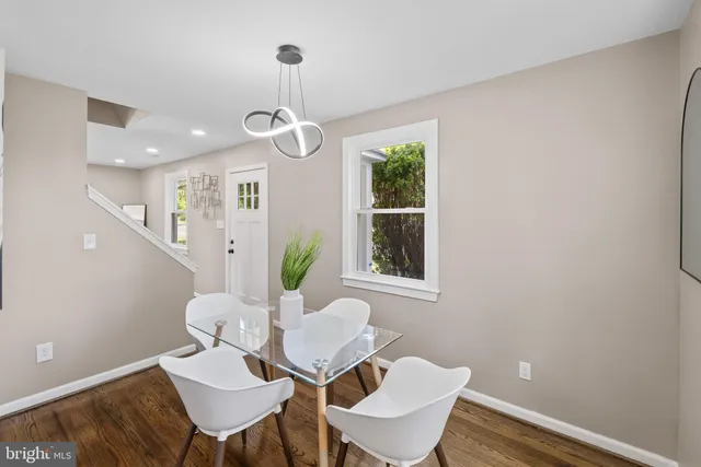 a view of a dining room with furniture and window