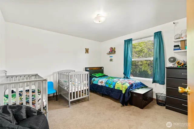 a bedroom with furniture and a window