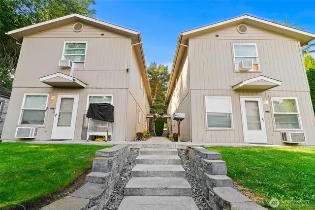 a front view of house with yard and green space