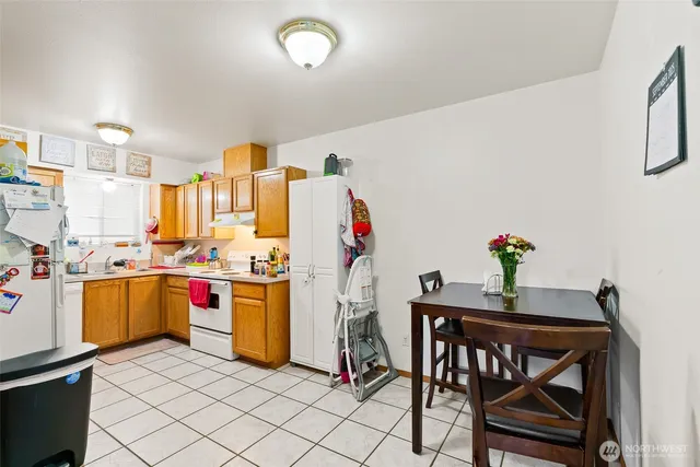 a view of kitchen with furniture and wooden floor