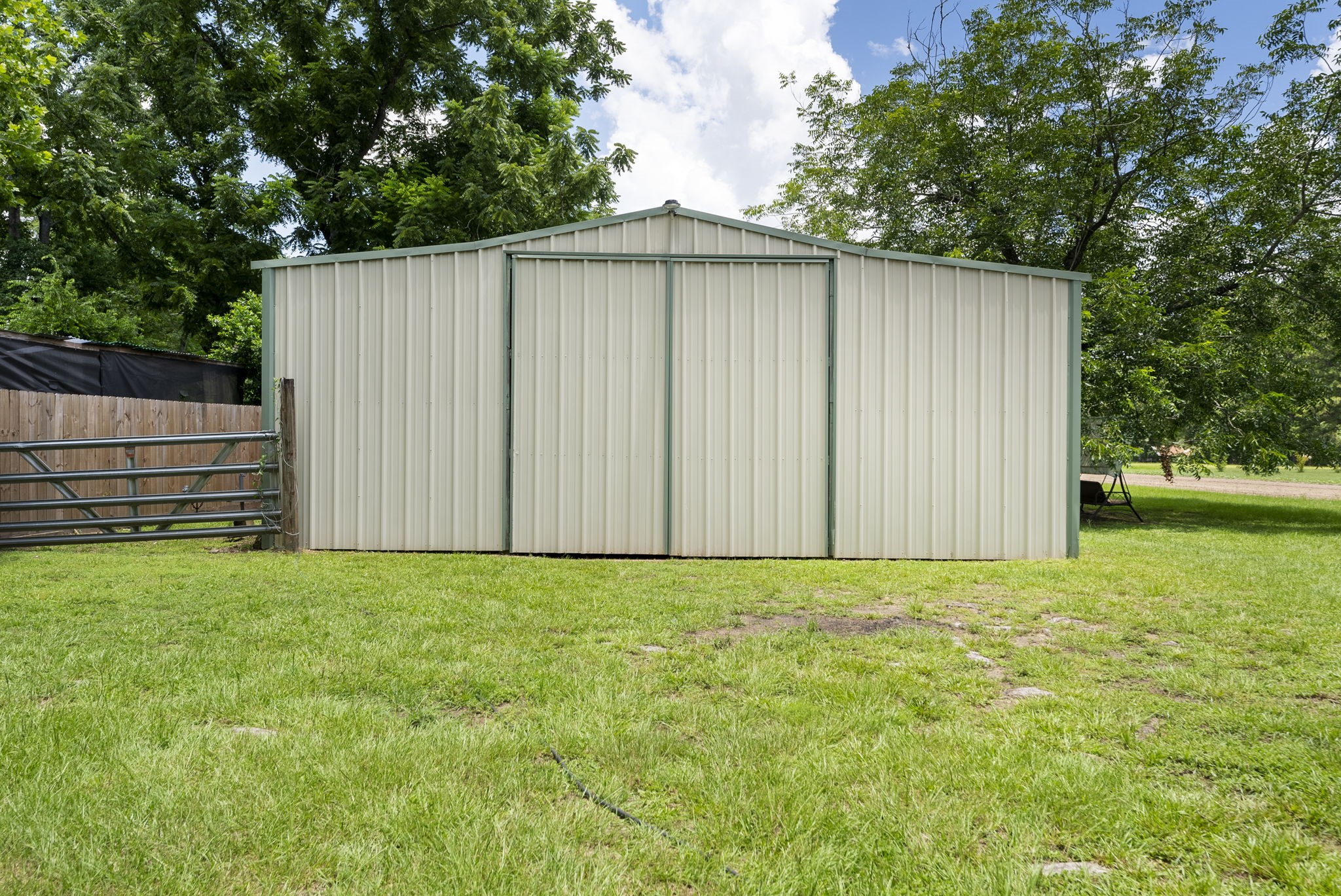 15091 Farm To Market 1485 Conroe, TX 77306 - Photo 6 of 11 a view of backyard with green space