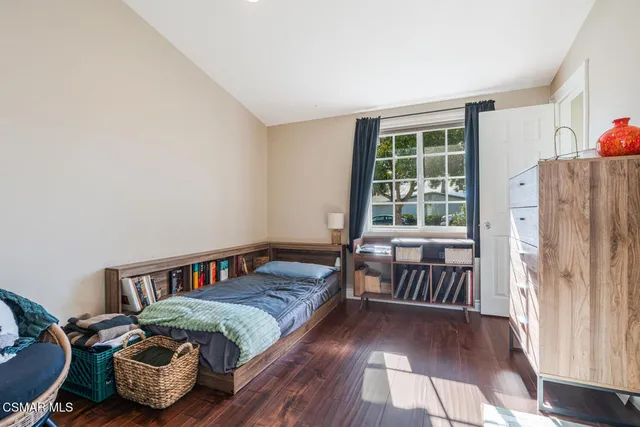 a bedroom with furniture and a window