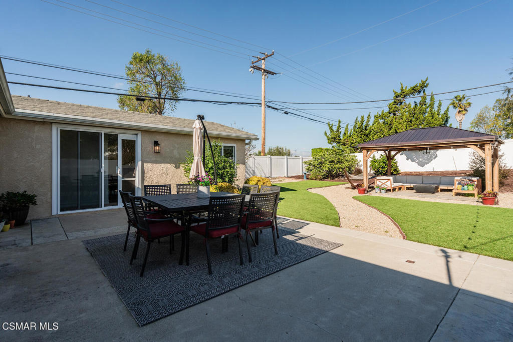 807 Briarcliff Road Thousand Oaks, CA 91360 - Photo 28 of 28 a view of a patio with dining table and chairs with a yard