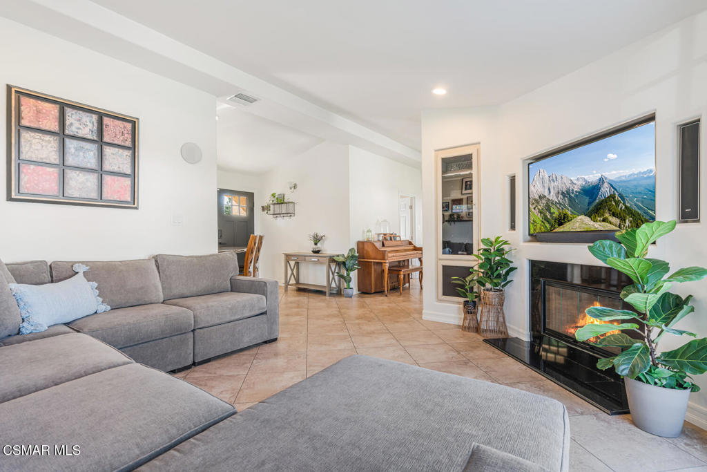 807 Briarcliff Road Thousand Oaks, CA 91360 - Photo 6 of 28 a living room with furniture a large window and a flat screen tv
