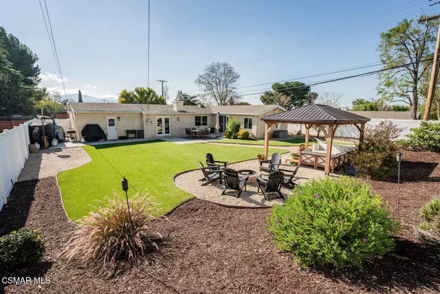 a view of a swimming pool with furniture