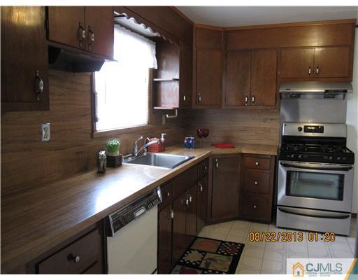 179 South Hill Road Colonia, NJ 07067 - Photo 7 of 19 a kitchen with a sink and cabinets