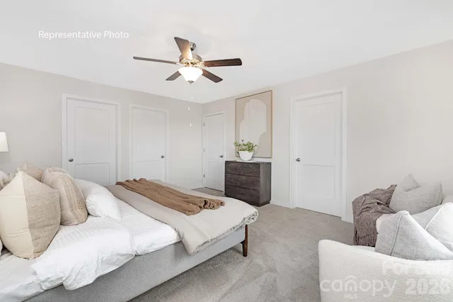 a bedroom with a bed and a couch