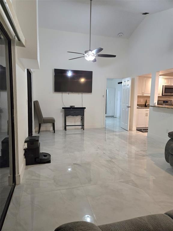 2280 Springwood Circle West Clearwater, FL 33763 - Photo 7 of 25 a view of a livingroom with furniture and a ceiling fan