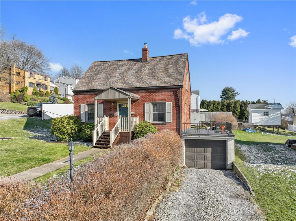 1006 Greenhill Road Pittsburgh, PA 15209 - Photo 2 of 24 a front view of a house with a yard