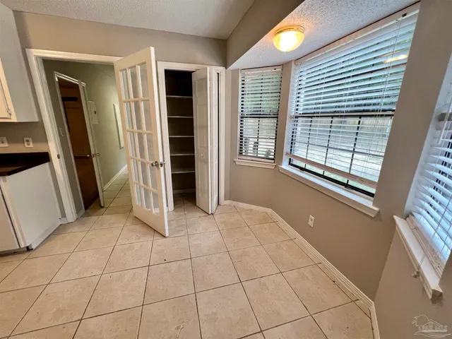 a kitchen with stainless steel appliances a refrigerator sink and cabinets