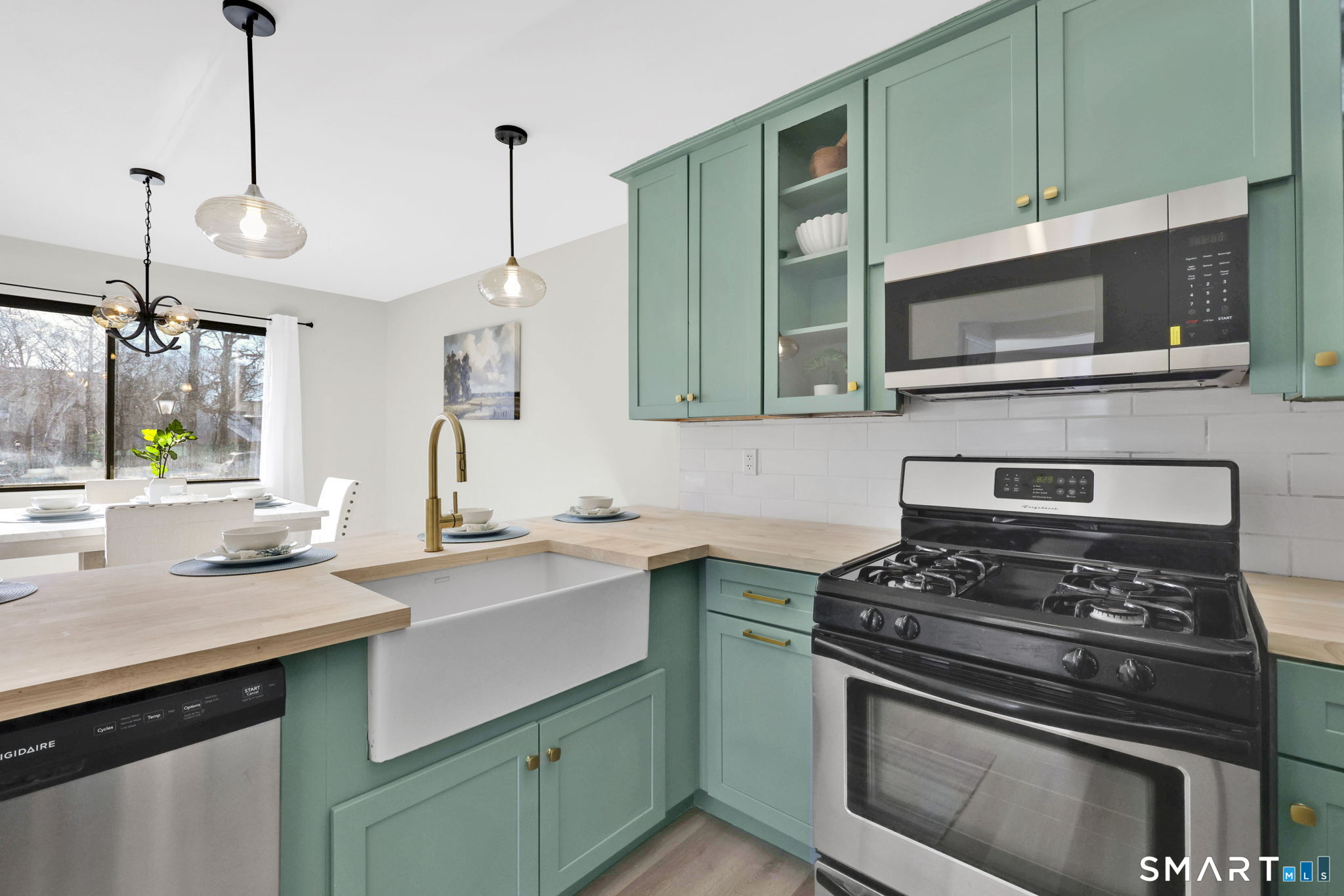 a kitchen with a stove and a sink