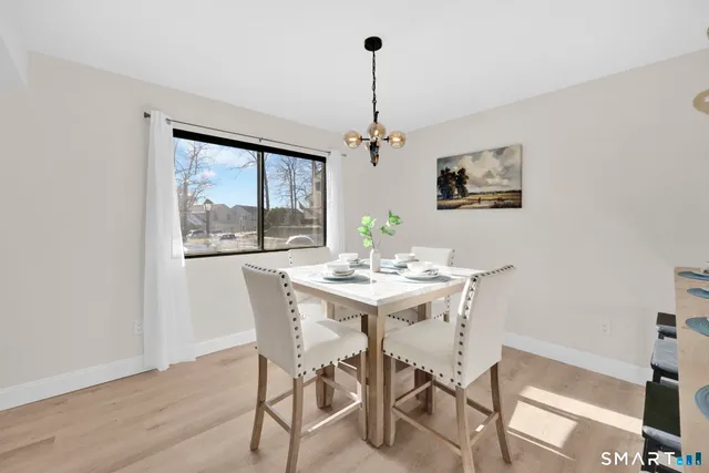 a view of a dining room with furniture window and outside view