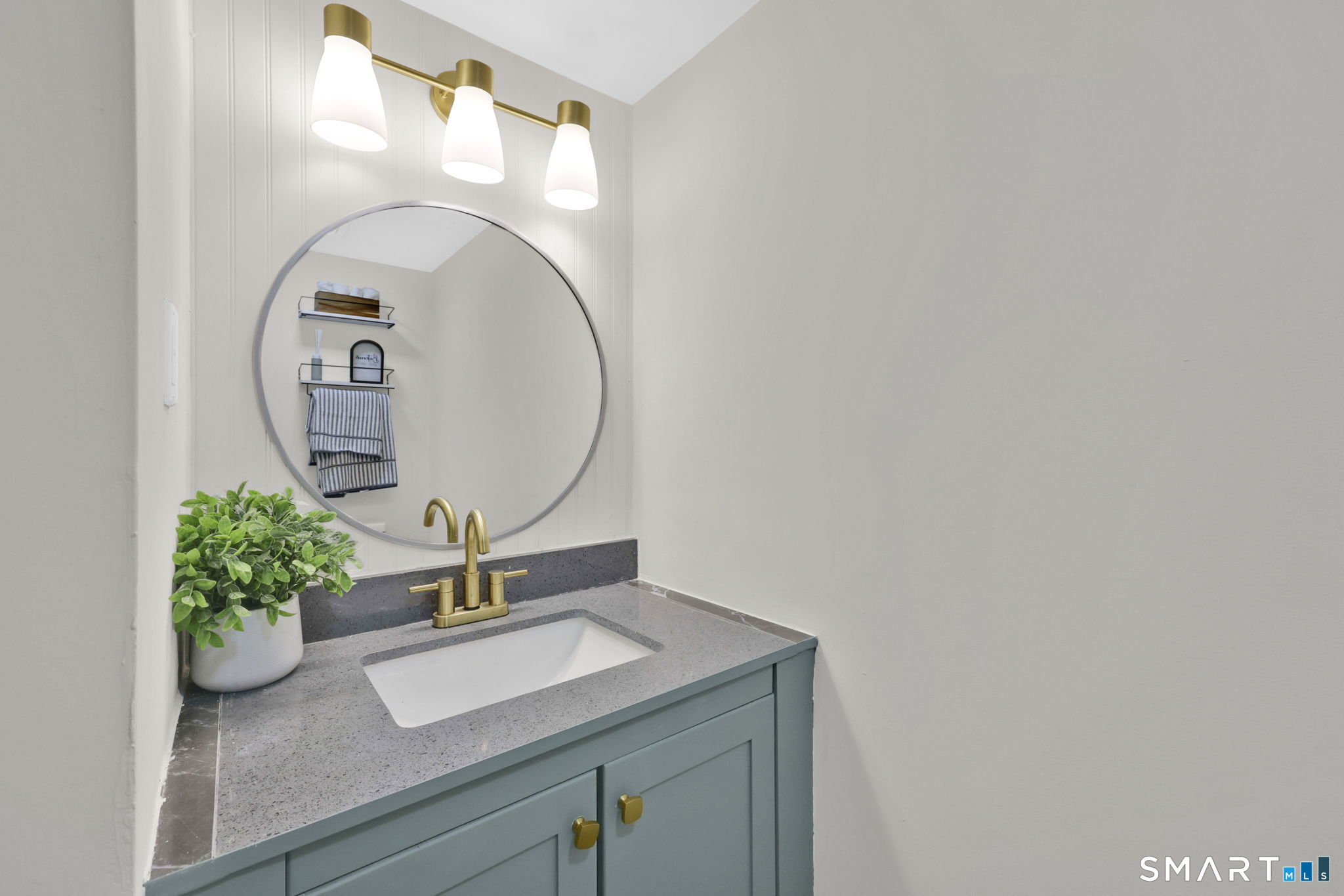 273 Cottonwood Road, Unit 273 Newington, CT 06111 - Photo 15 of 38 a bathroom with a sink and a mirror