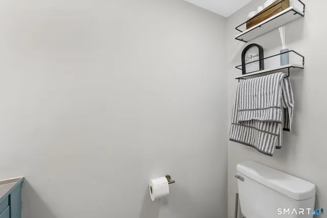 a bathroom with a toilet and a sink