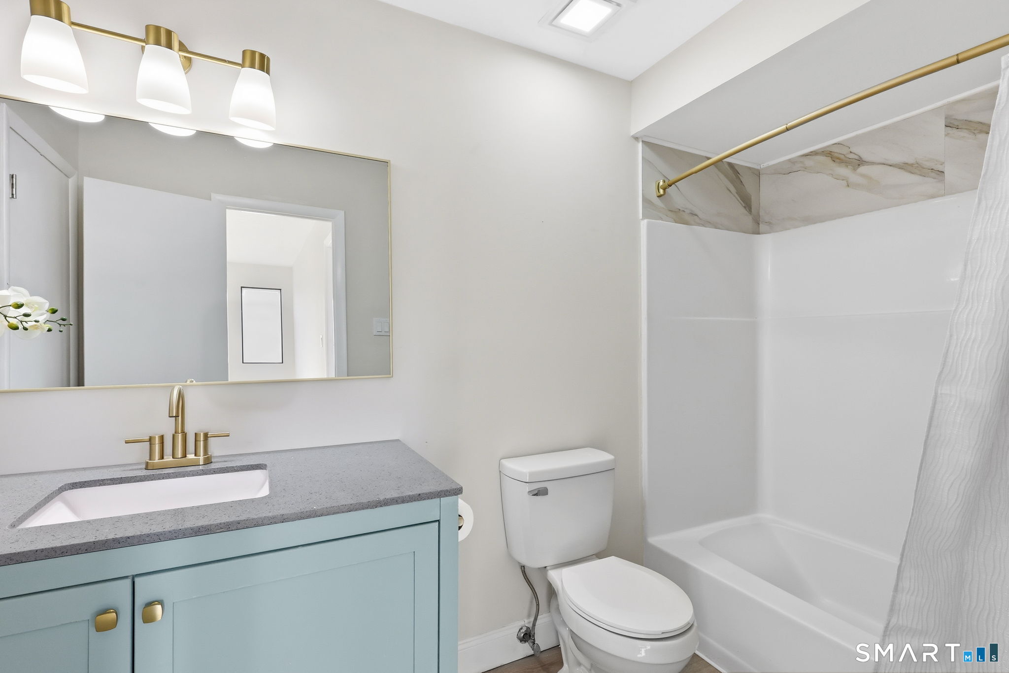 273 Cottonwood Road, Unit 273 Newington, CT 06111 - Photo 20 of 38 a bathroom with a sink a toilet and shower