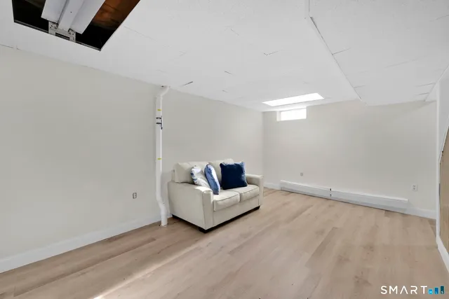 a living room with hard wood floors