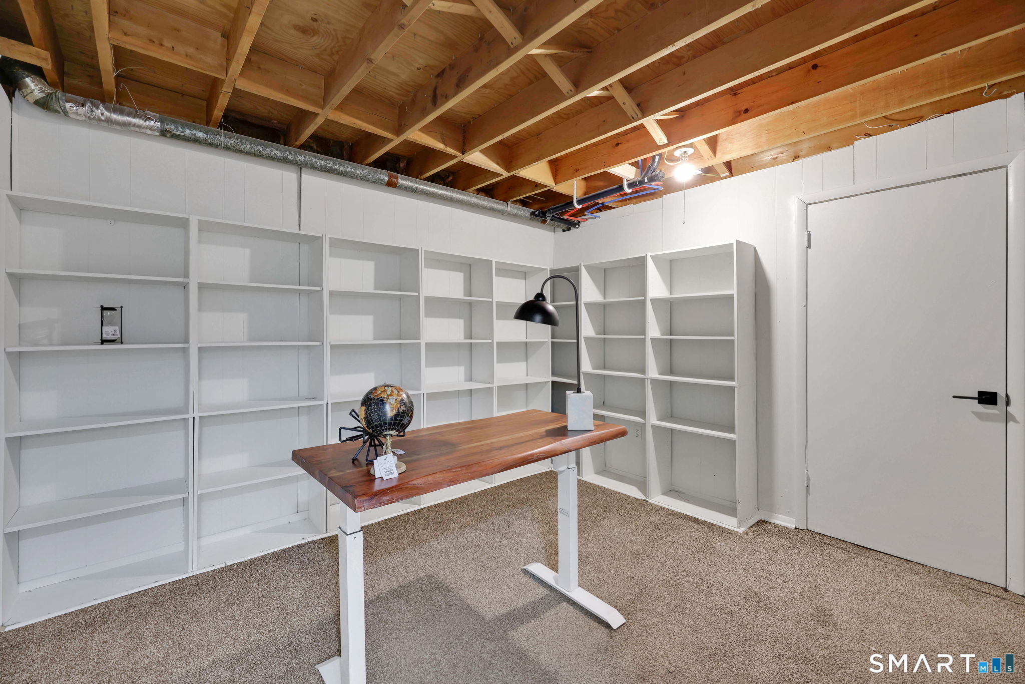 273 Cottonwood Road, Unit 273 Newington, CT 06111 - Photo 27 of 38 a view of a room with shelves