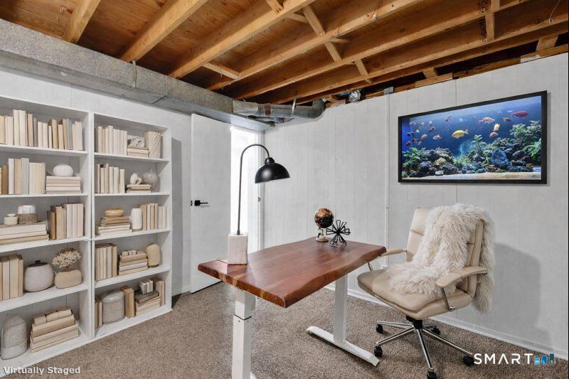 273 Cottonwood Road, Unit 273 Newington, CT 06111 - Photo 28 of 38 a room with furniture and book shelf