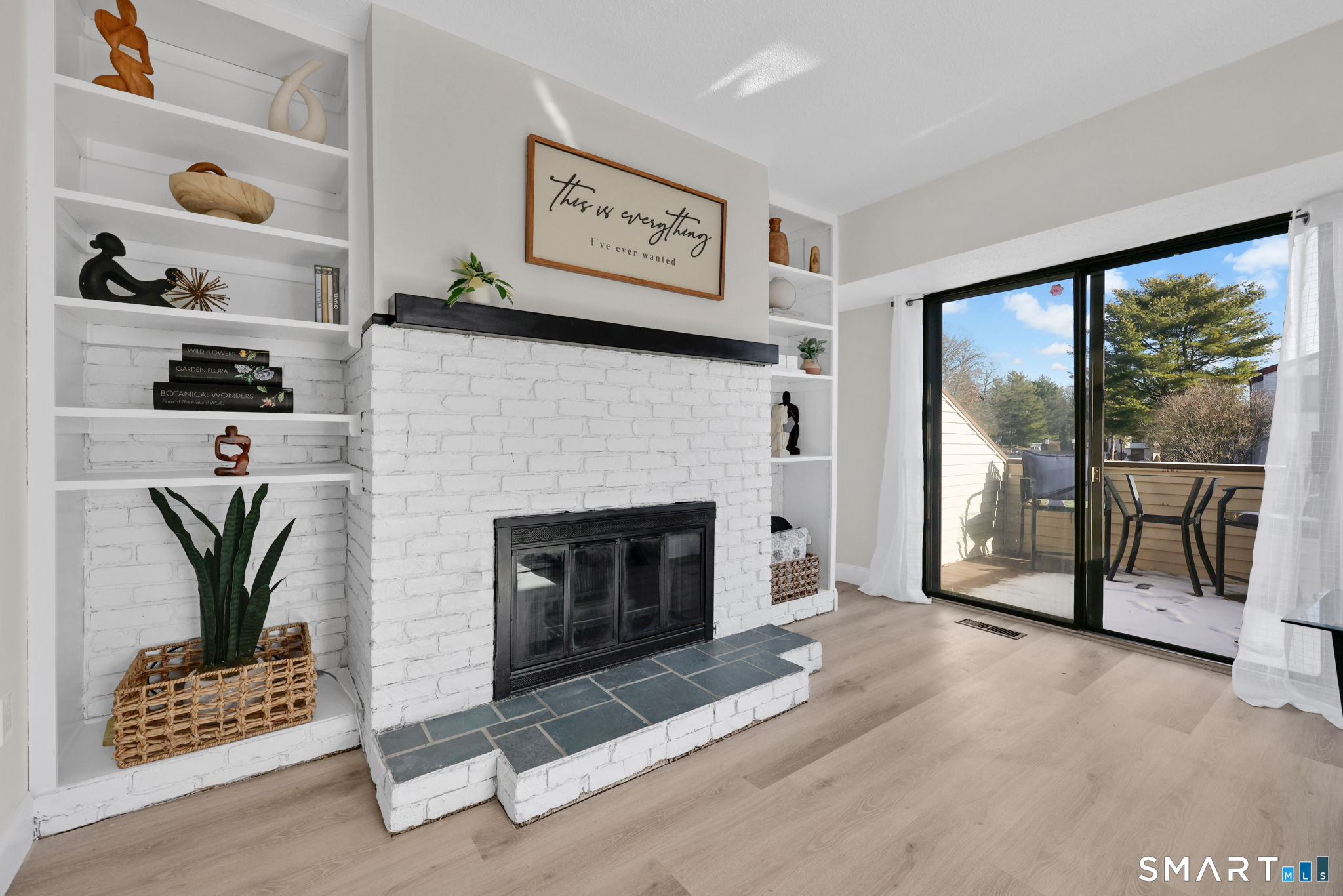 273 Cottonwood Road, Unit 273 Newington, CT 06111 - Photo 5 of 38 a living room with furniture and a fireplace