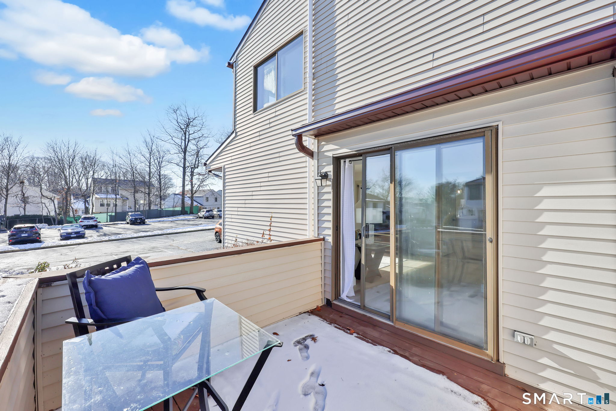 273 Cottonwood Road, Unit 273 Newington, CT 06111 - Photo 8 of 38 a balcony with furniture and a potted plant