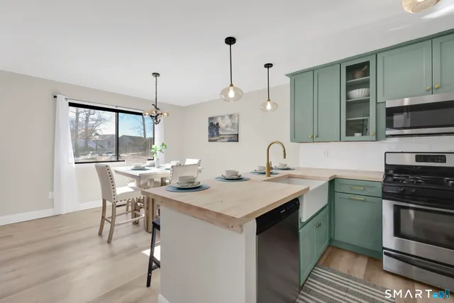 a kitchen with a sink and stove