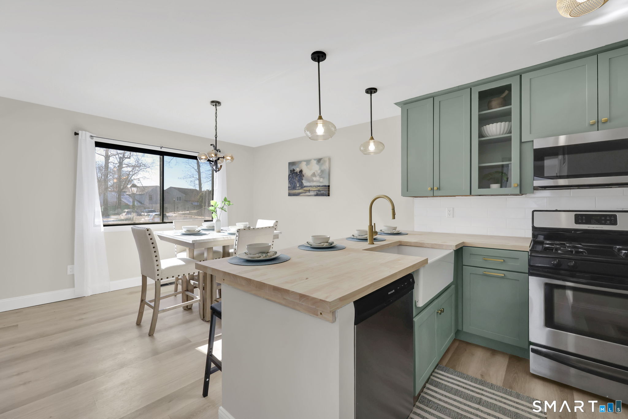 273 Cottonwood Road, Unit 273 Newington, CT 06111 - Photo 10 of 38 a kitchen with a sink and stove