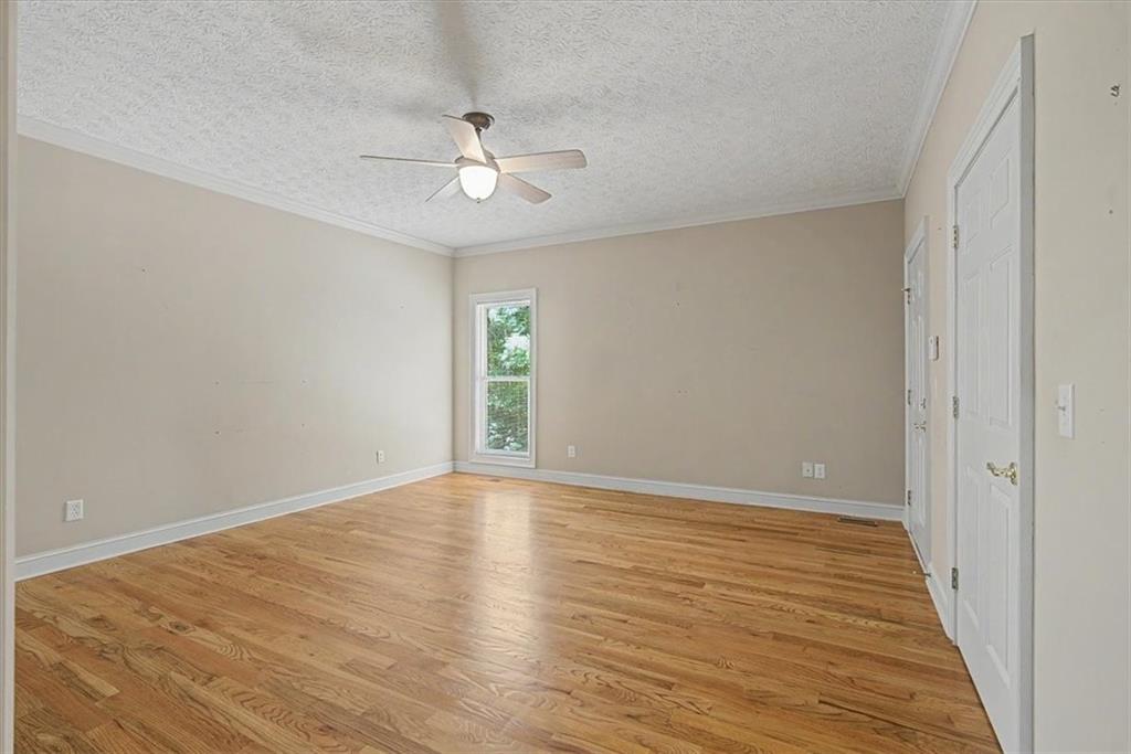 1136 Cole Lake Road Dallas, GA 30157 - Photo 29 of 72 a view of an empty room with wooden floor