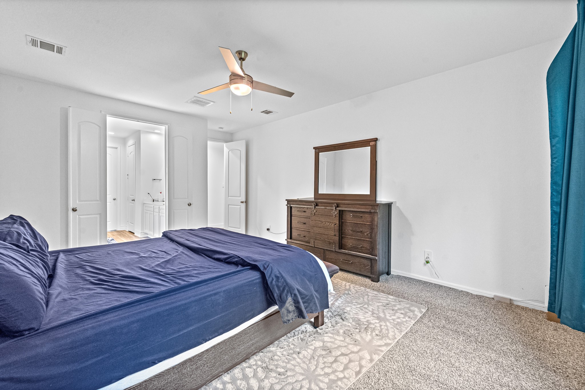 15814 Gibson Grass Court Spring, TX 77379 - Photo 13 of 26 a bedroom with a bed and a television